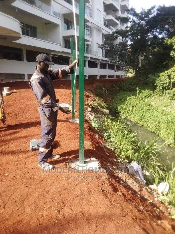 Black Mesh Fence With Razor Top