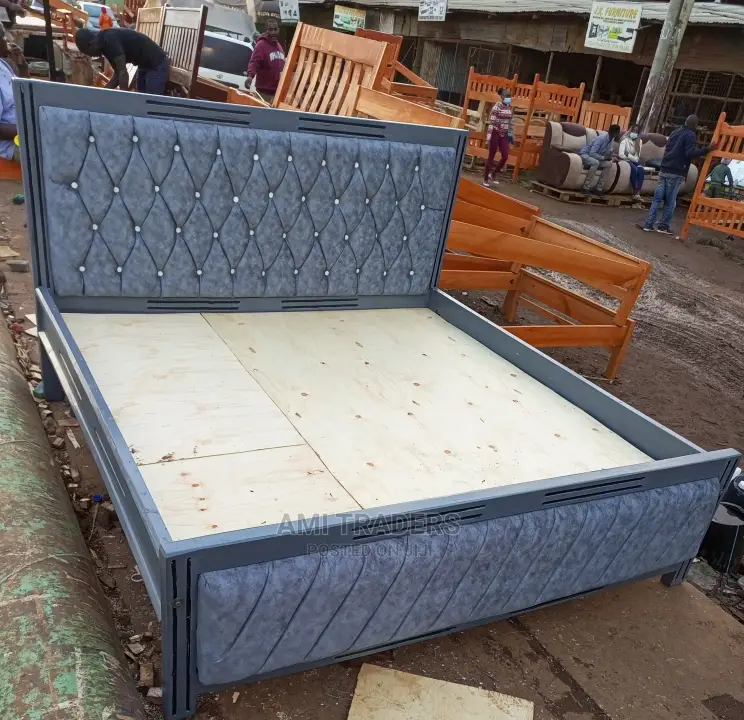 Grey Tufted Bed.
