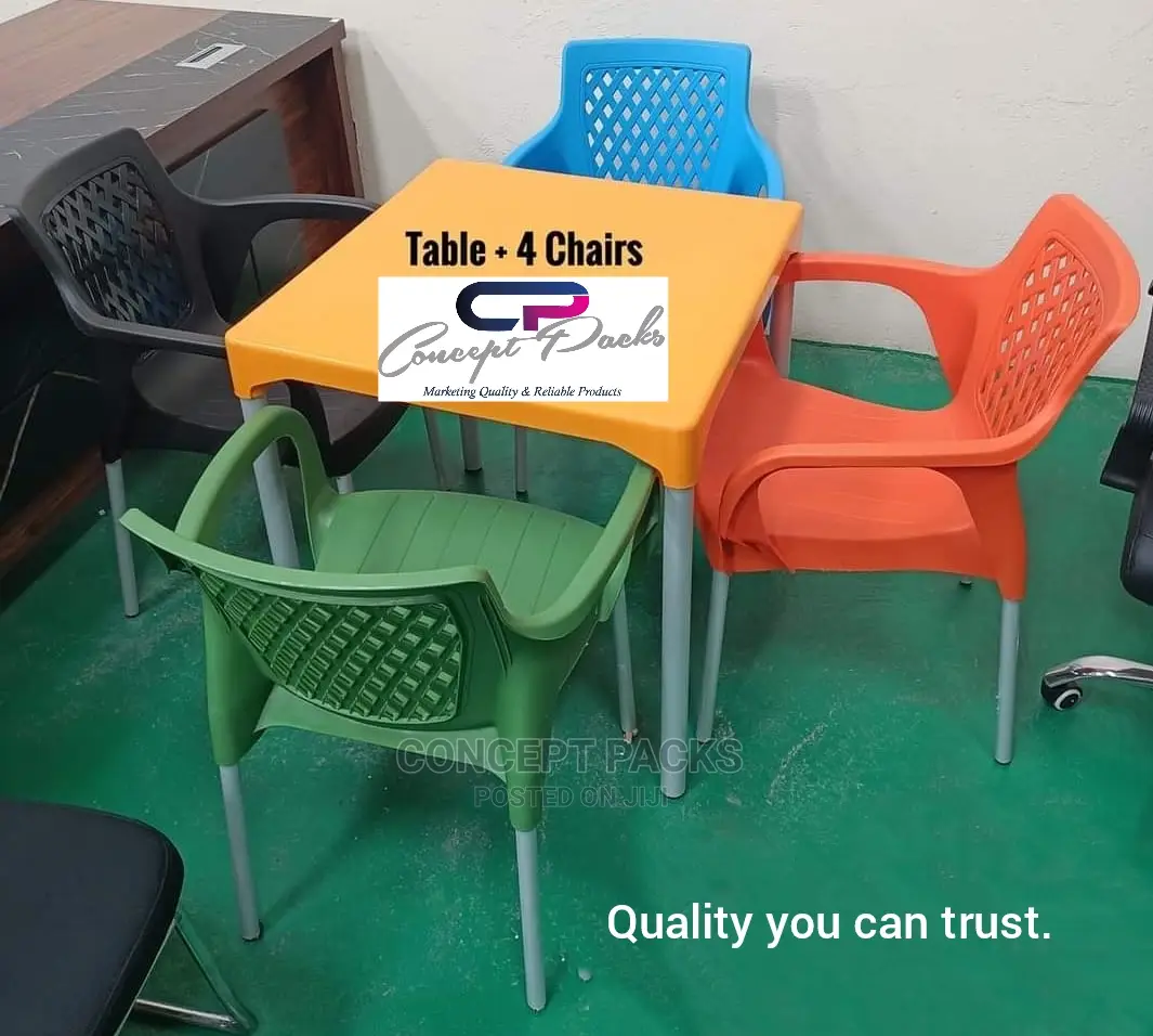 Plastic Table + 4 Chairs With Metallic Legs.