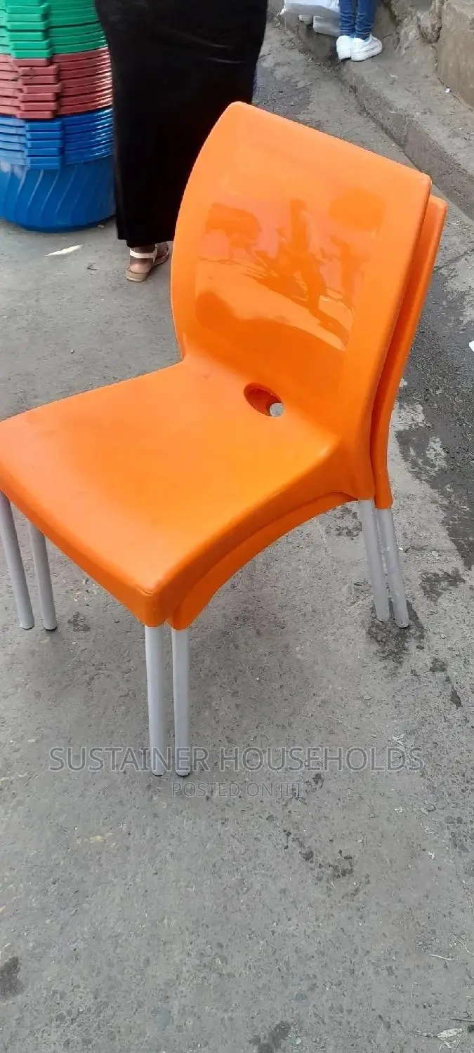 Orange Plastic Chairs With Metal Tubing Legs
