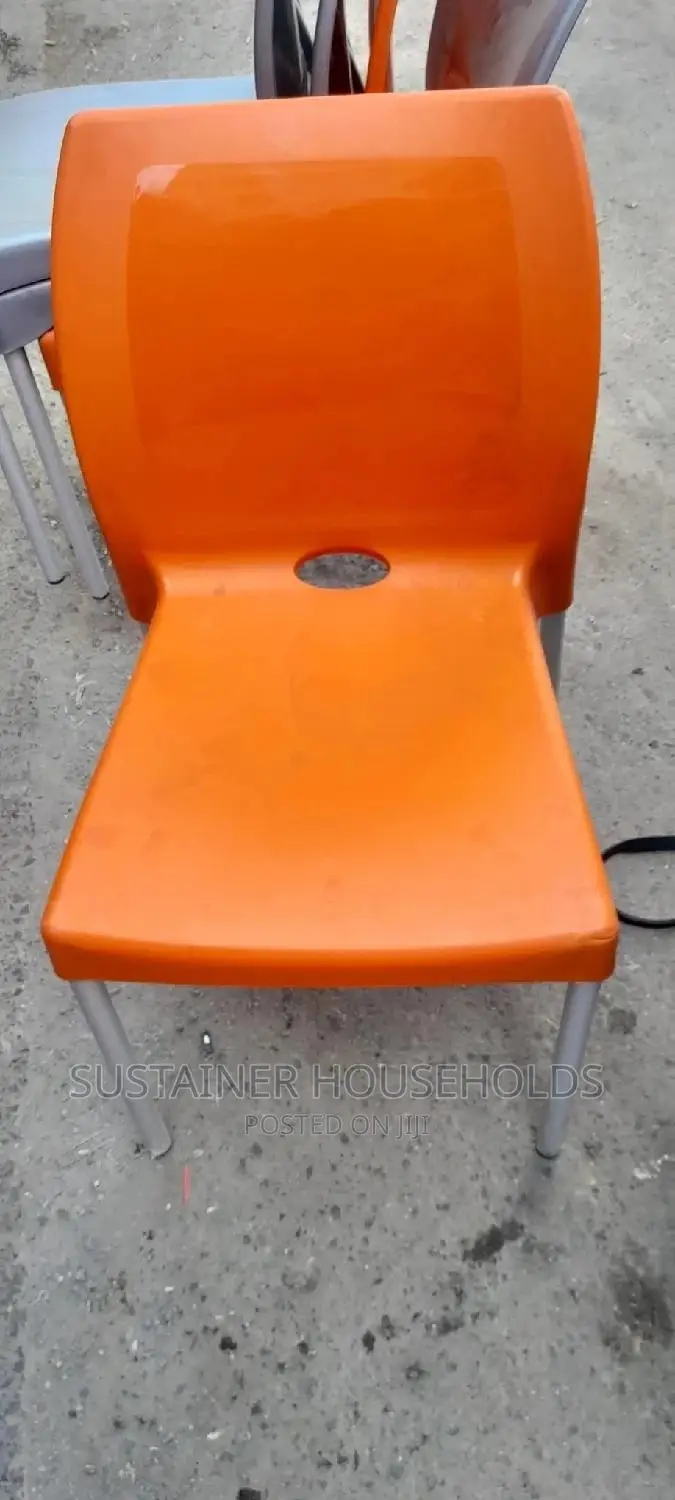 Orange Plastic Chairs With Metal Tubing Legs