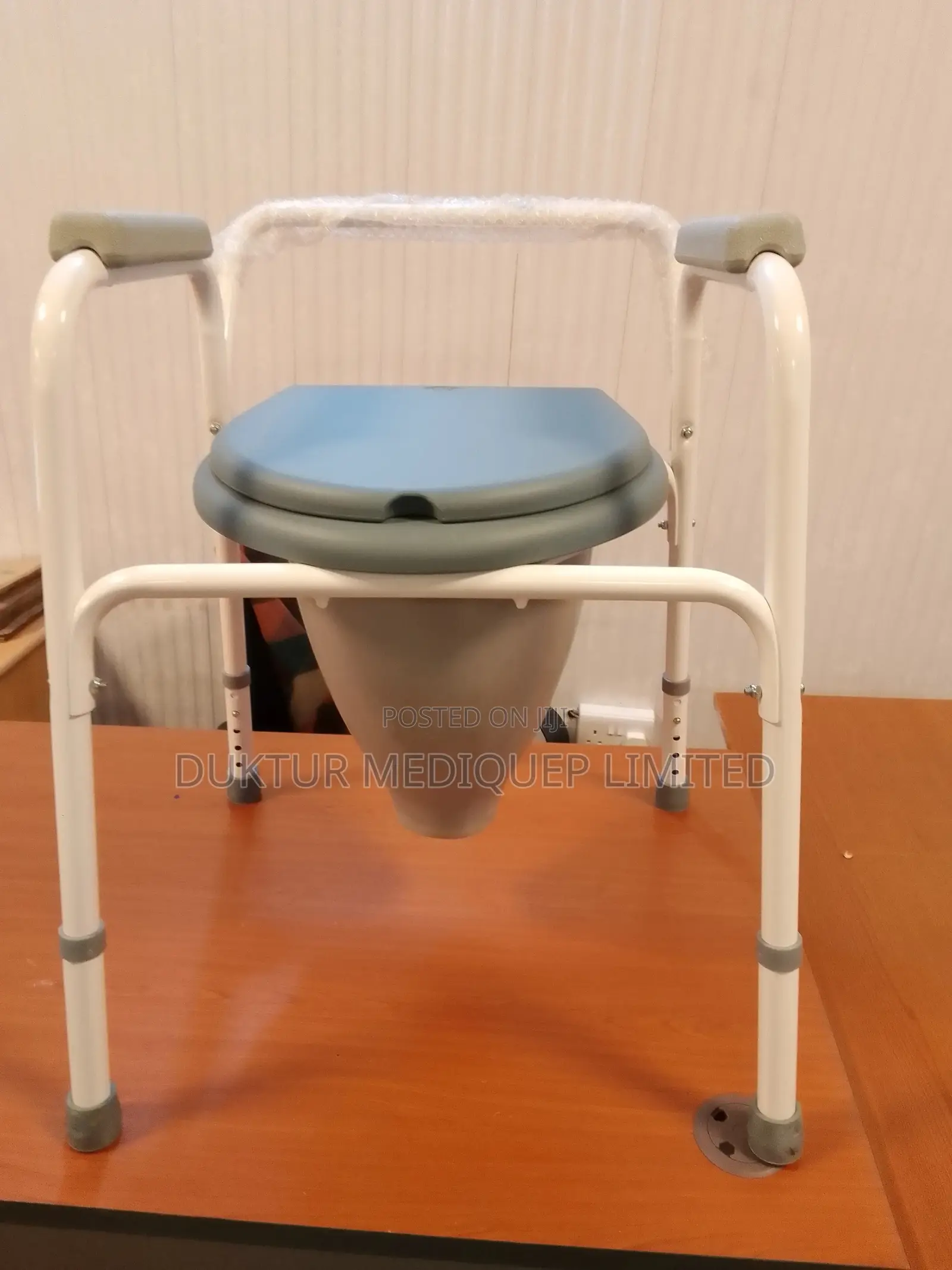 Toilet Commode Chair With a Funnel and Bowl