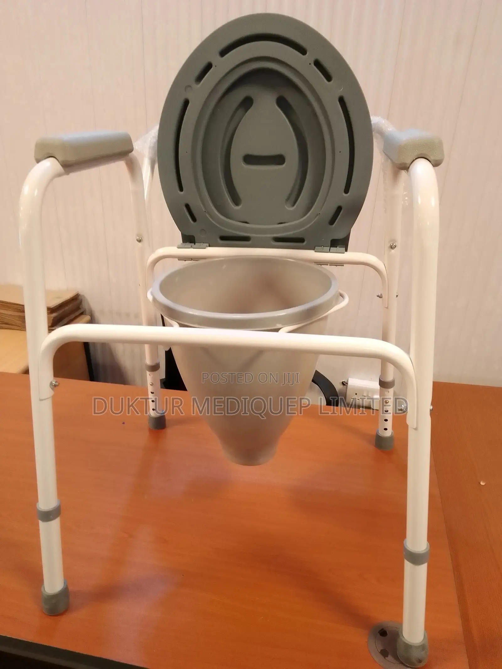 Toilet Commode Chair With a Funnel and Bowl