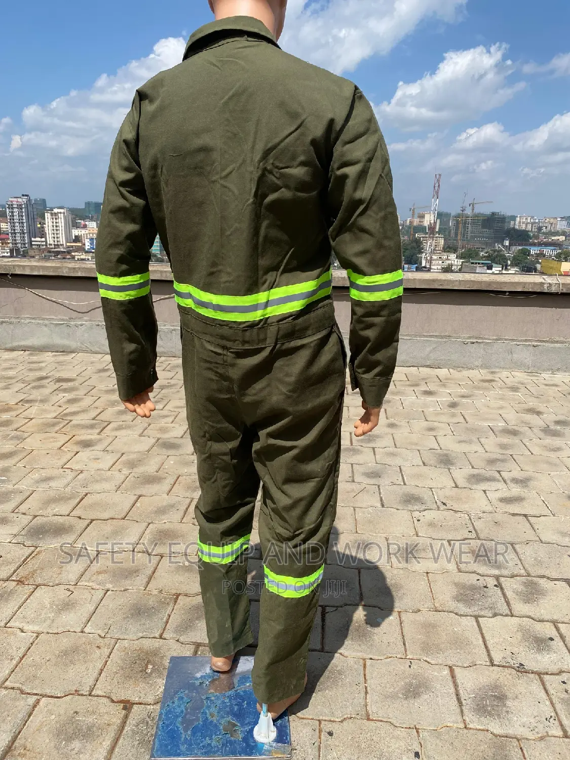 Green Overalls With Luminous Reflectors.