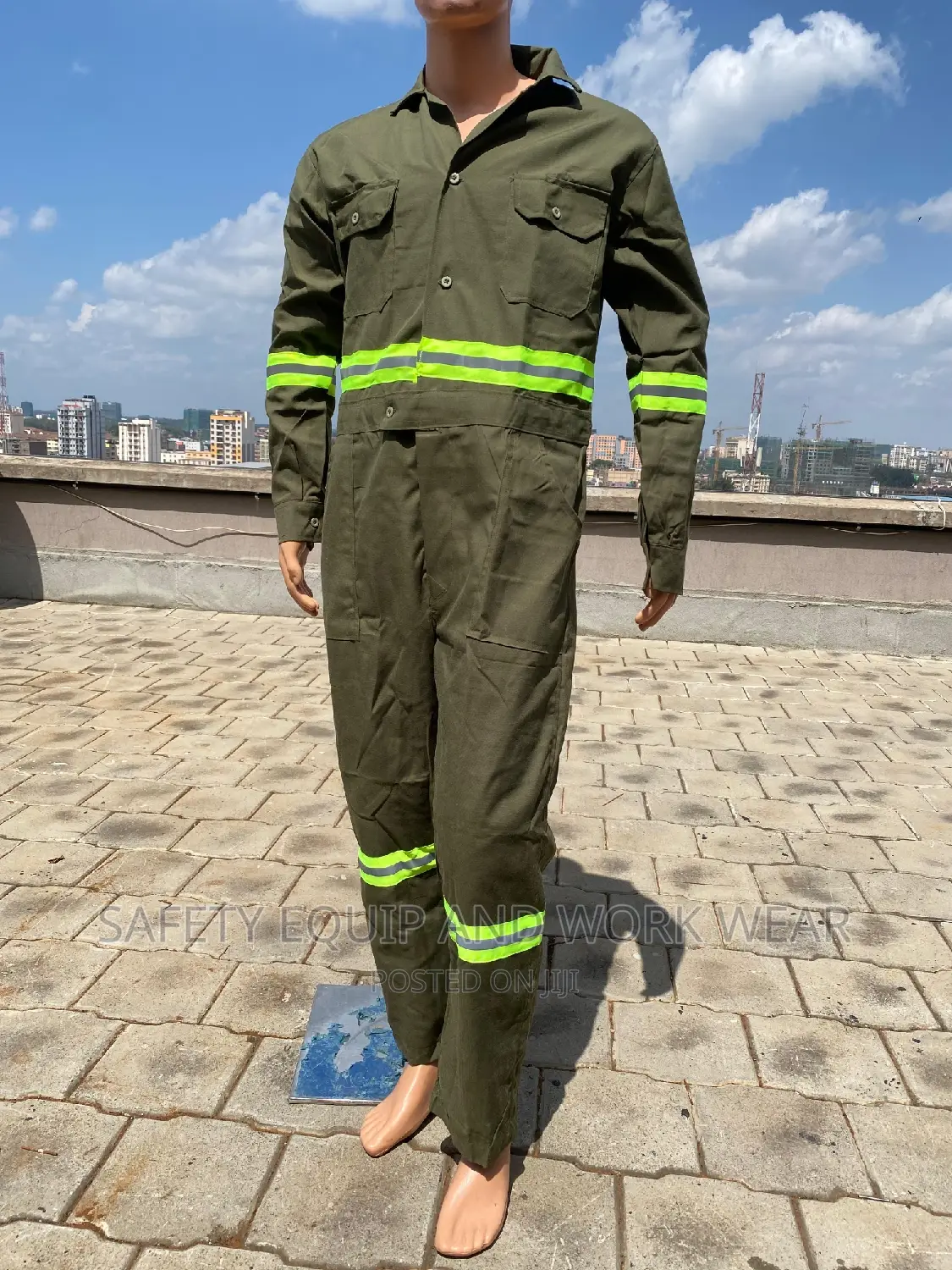 Green Overalls With Luminous Reflectors.