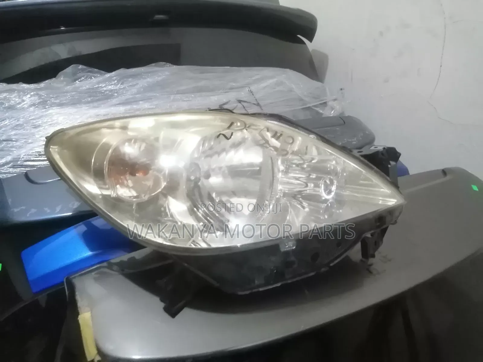 Mazda Demio 2005/2006 Non Xenon Head Lamp, Clean EX Japan