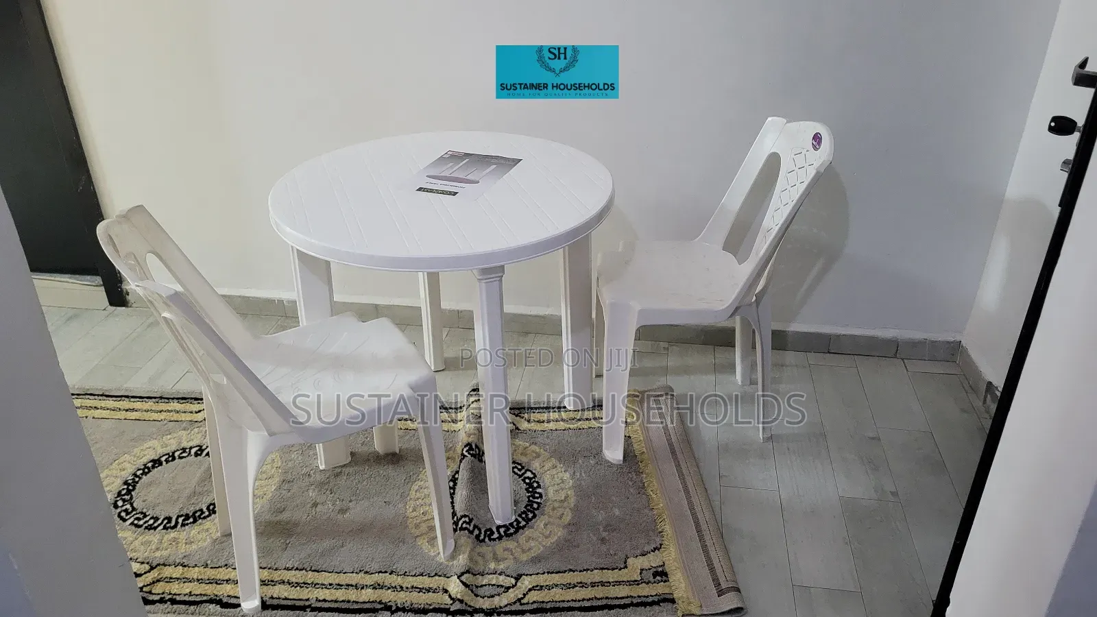 2 Armless Plastic Chairs With a Complast Plastic Table Set