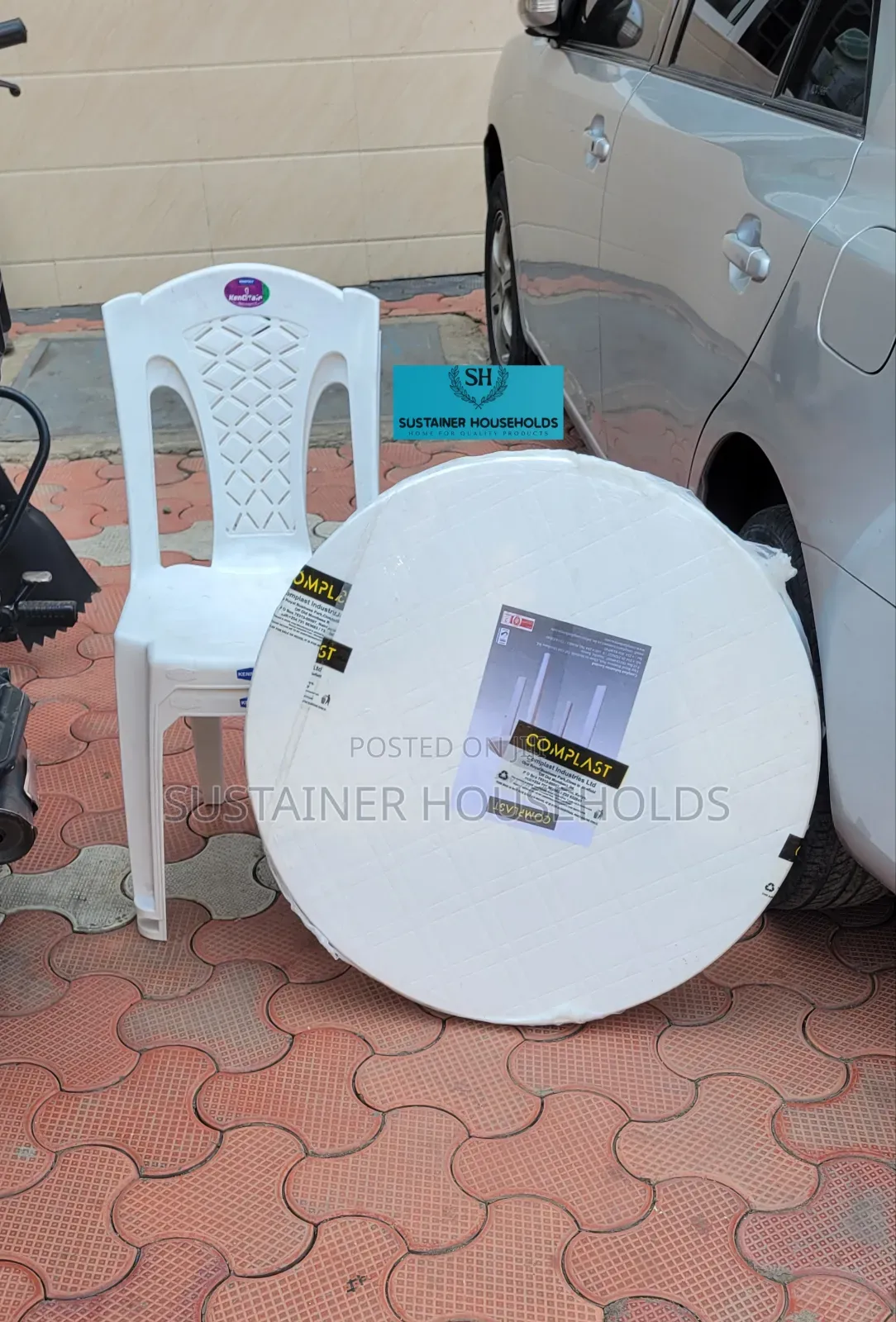 Round Plastic Table With 2 Armless Kenpoly Plastic Chairs