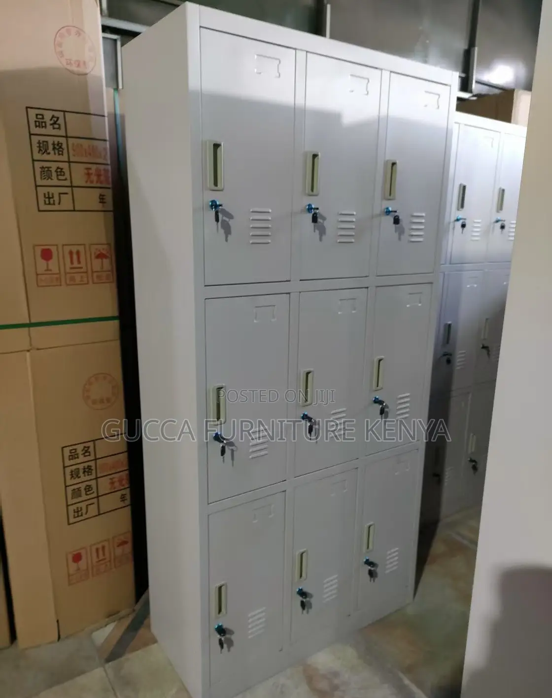 Cabinets: Metallic Vertical Nine-Door Locker Storage Unit