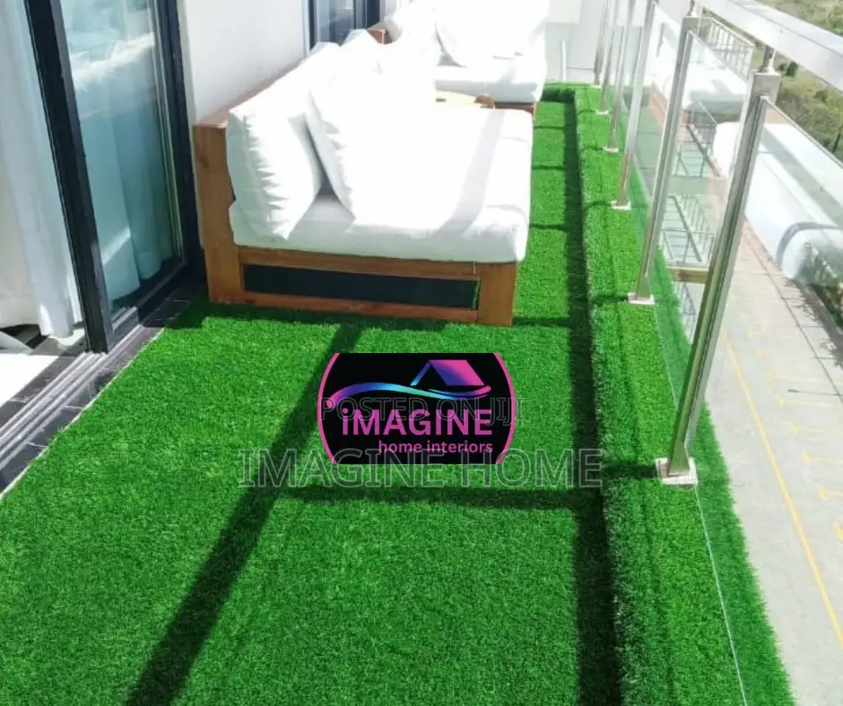 Chair Sits Space With Artificial Green Fences