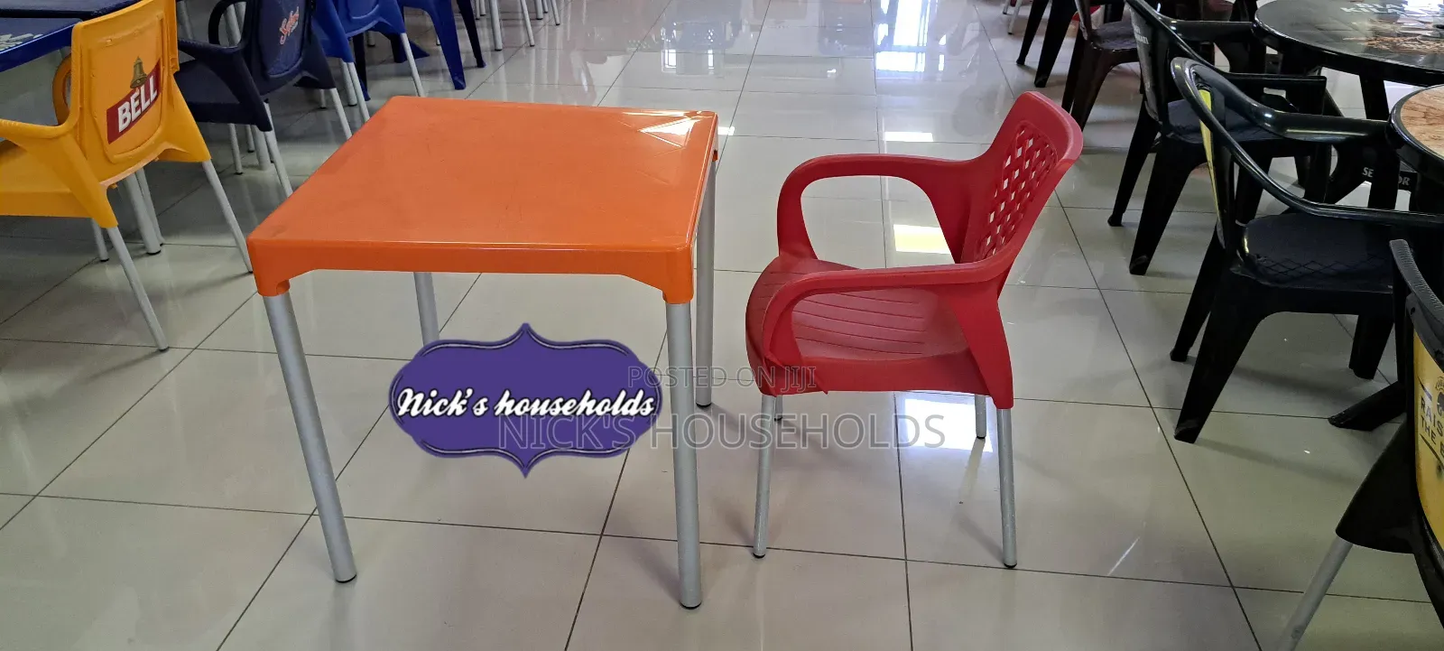 Plastic Table With a Plastic Chair (All With Metal Tubing