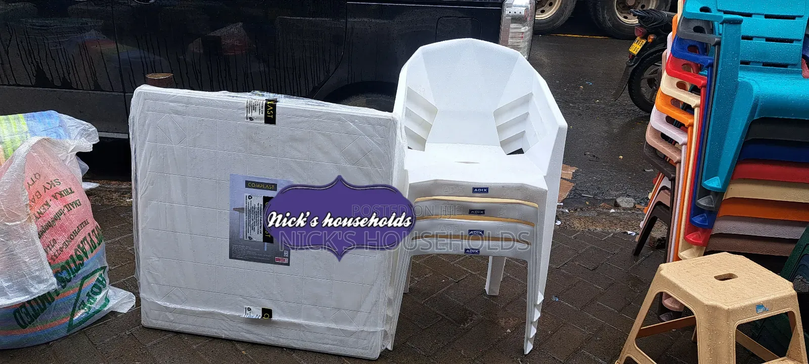 4 Plastic Chairs With Square White Plastic Table
