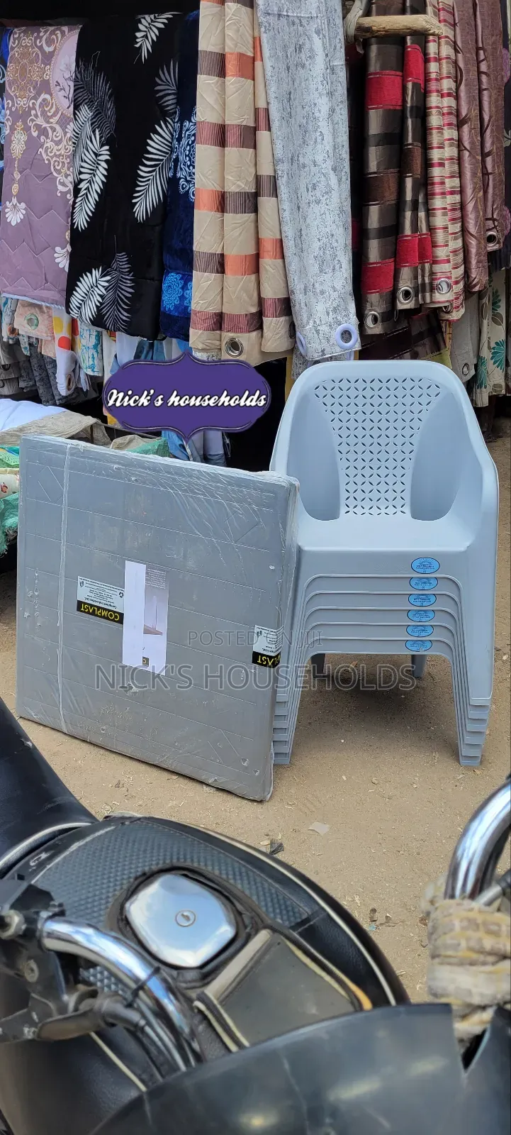 4 Plastic Chairs With a Square Plastic Table Set