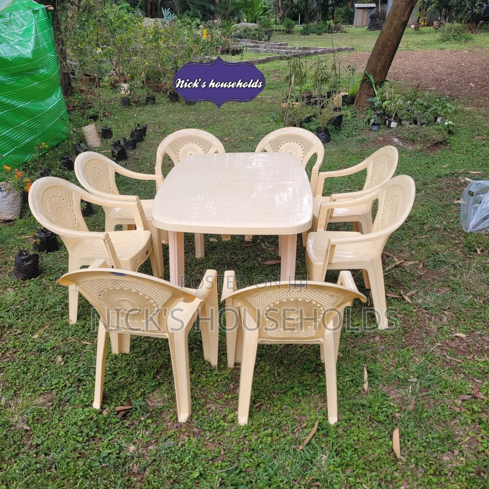 Cream Plastic Chairs With a Rectangular Plastic Table Set