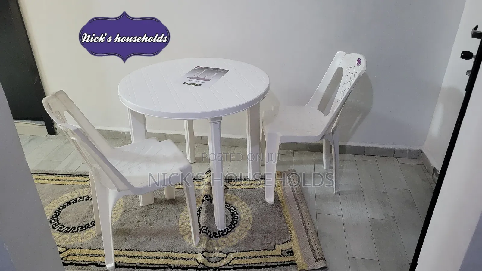 White Armless Chairs With a Complast Plastic Table Set