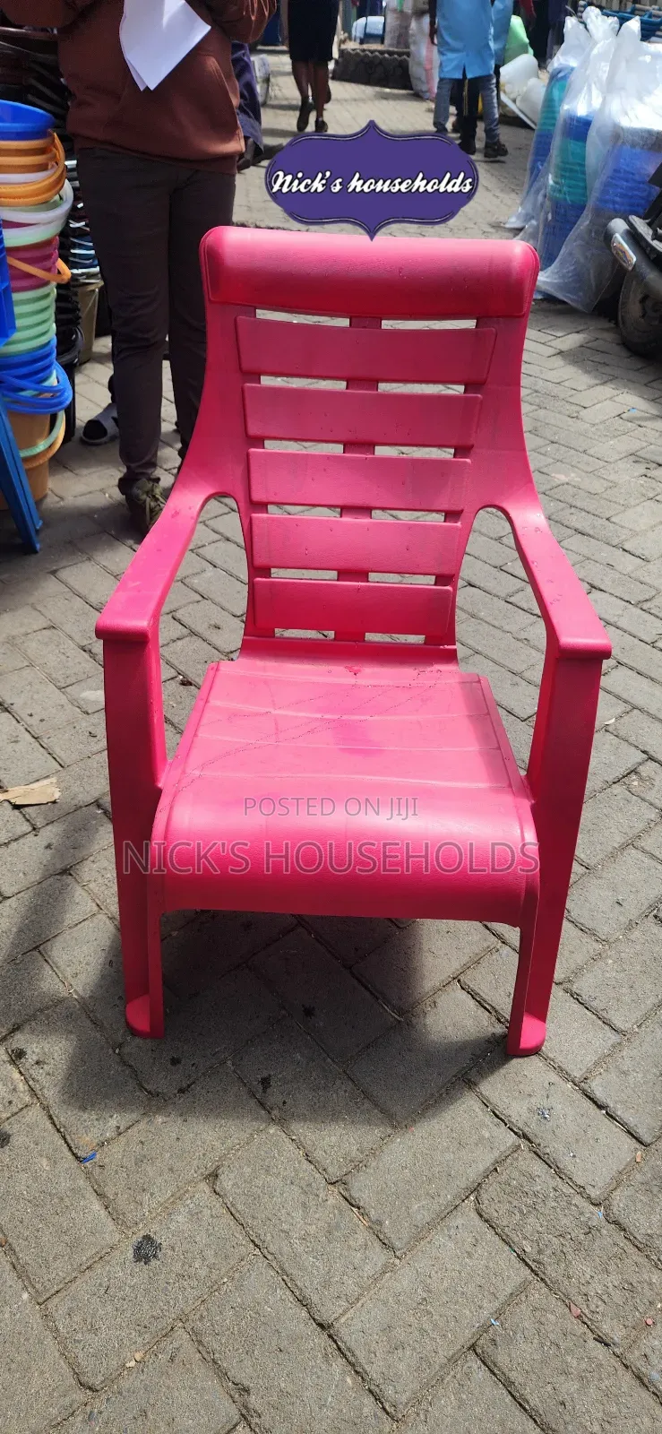 Pink Plastic Chair With Armrest Andslanting Backrest
