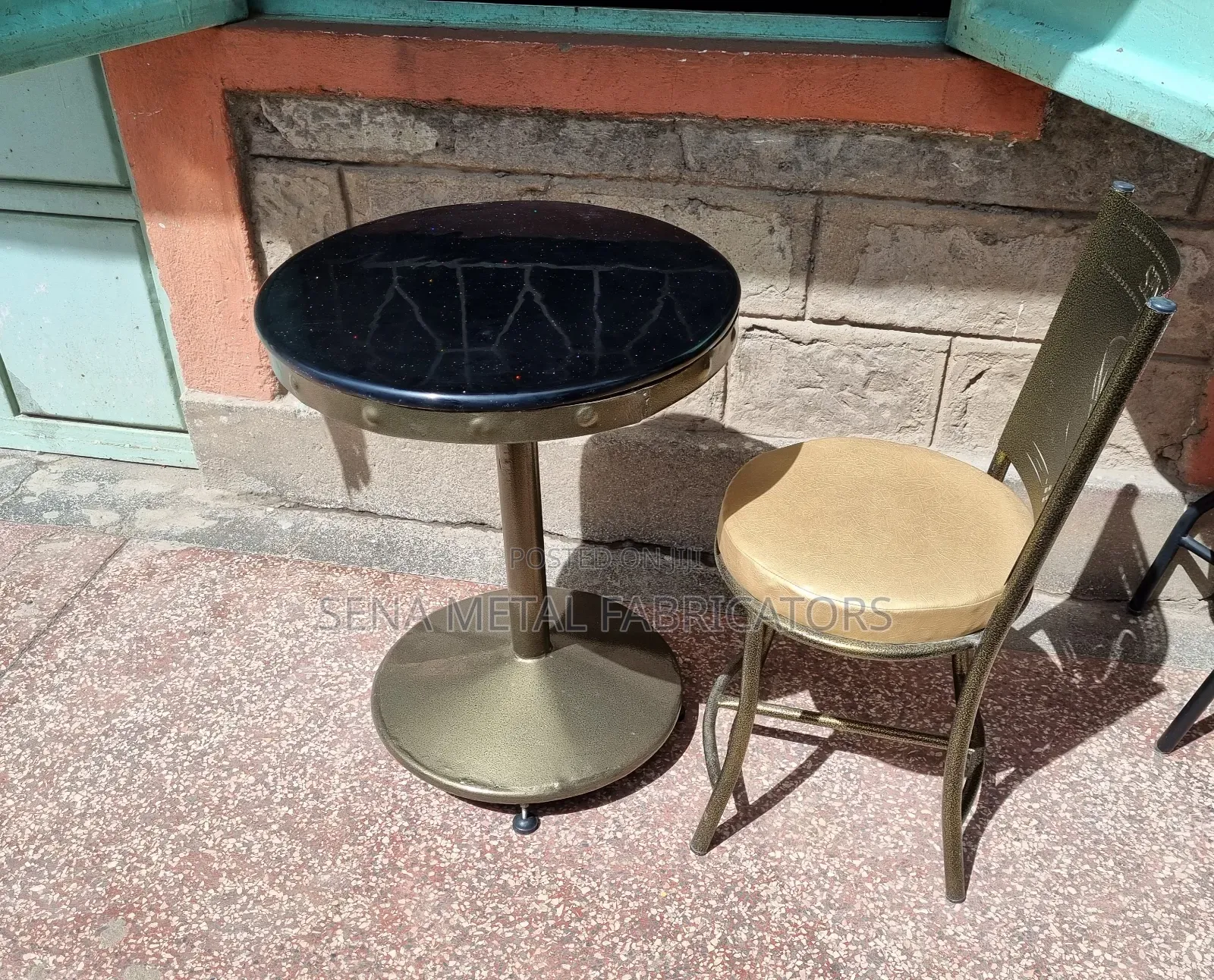 Restaurant Table With Black Marble Top.