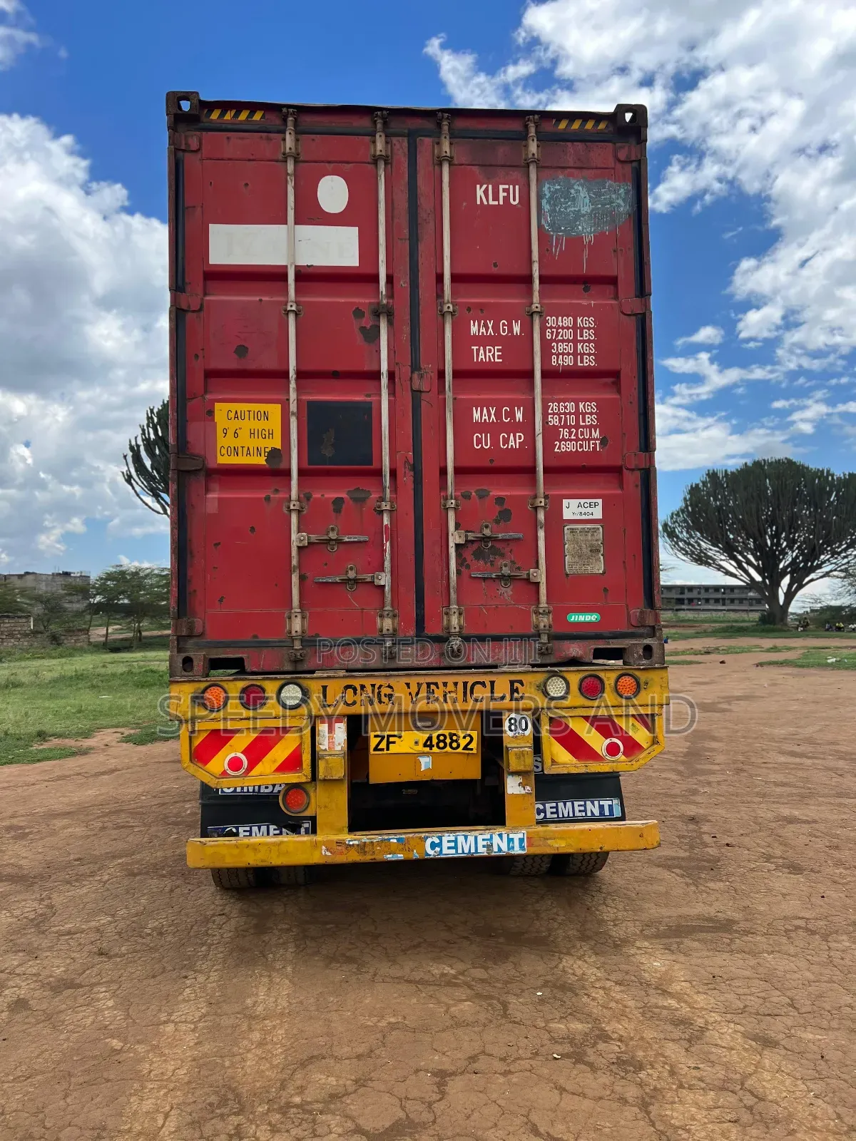 Containerized Trailer Accessible for Loose Cargo Transport