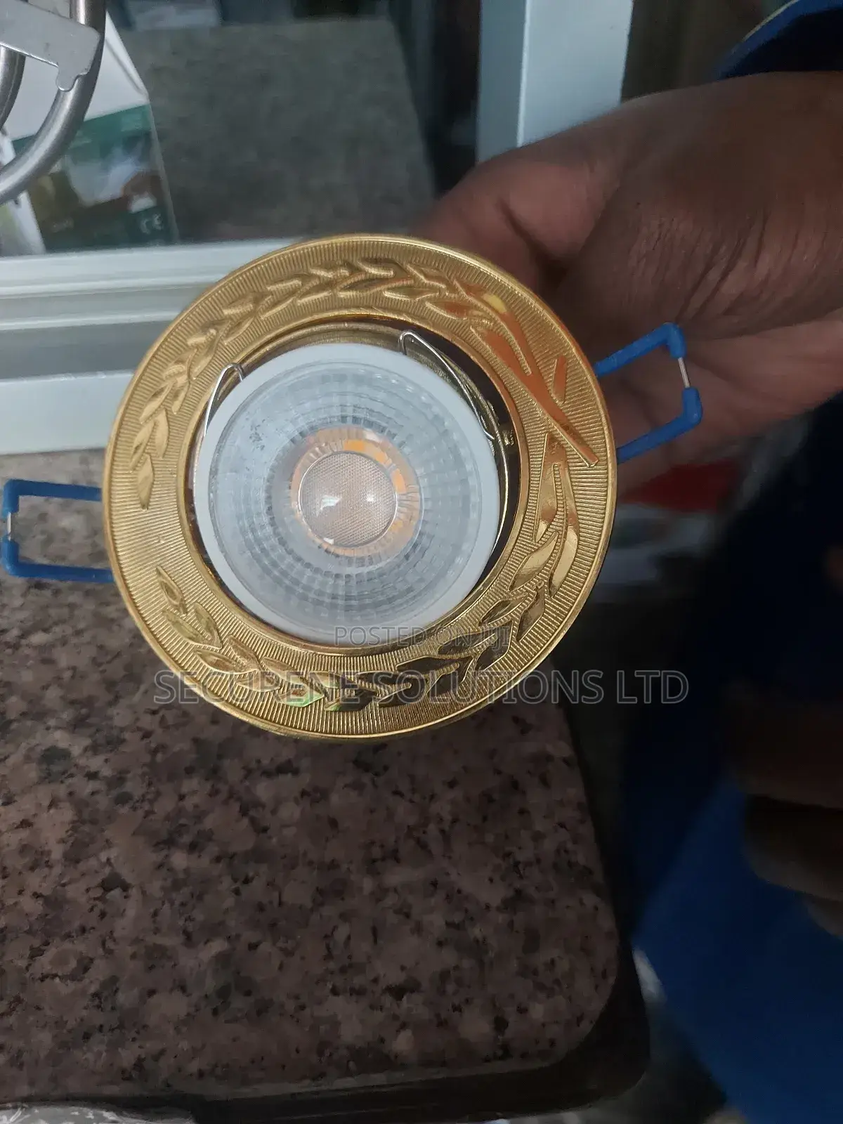 Round, Golden-Colored Recessed Spotlight Frame