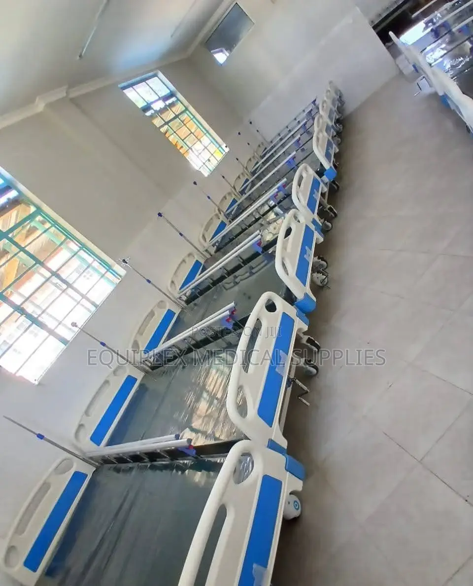Single Crank Hospital Bed With Mattress, Mackintosh, And A Drip Stand