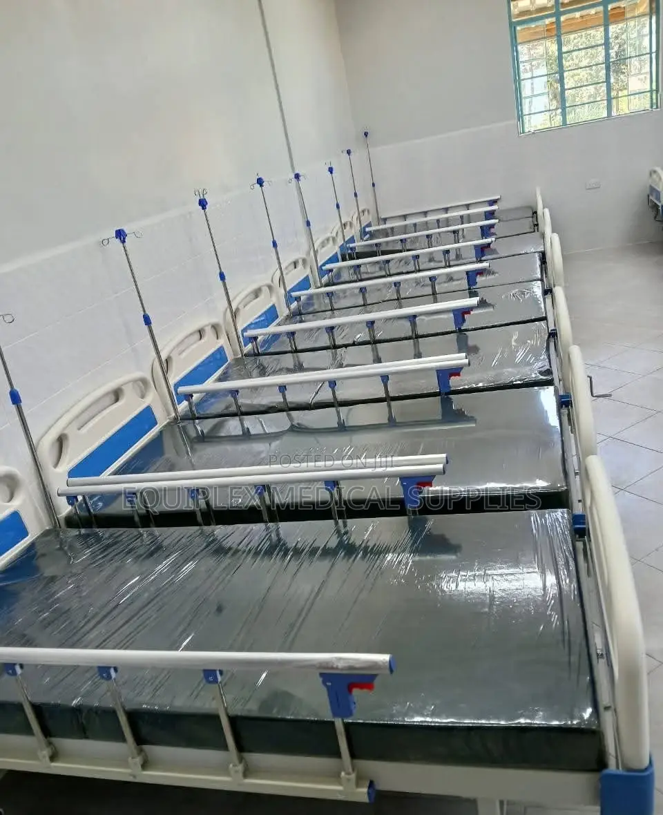 Single Crank Hospital Bed With Mattress, Mackintosh, And A Drip Stand
