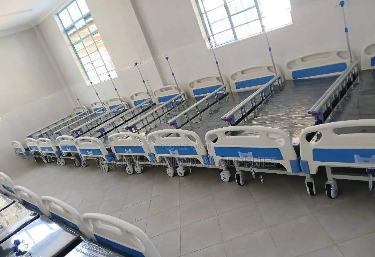 Single Crank Hospital Bed With Mattress, Mackintosh, And A Drip Stand