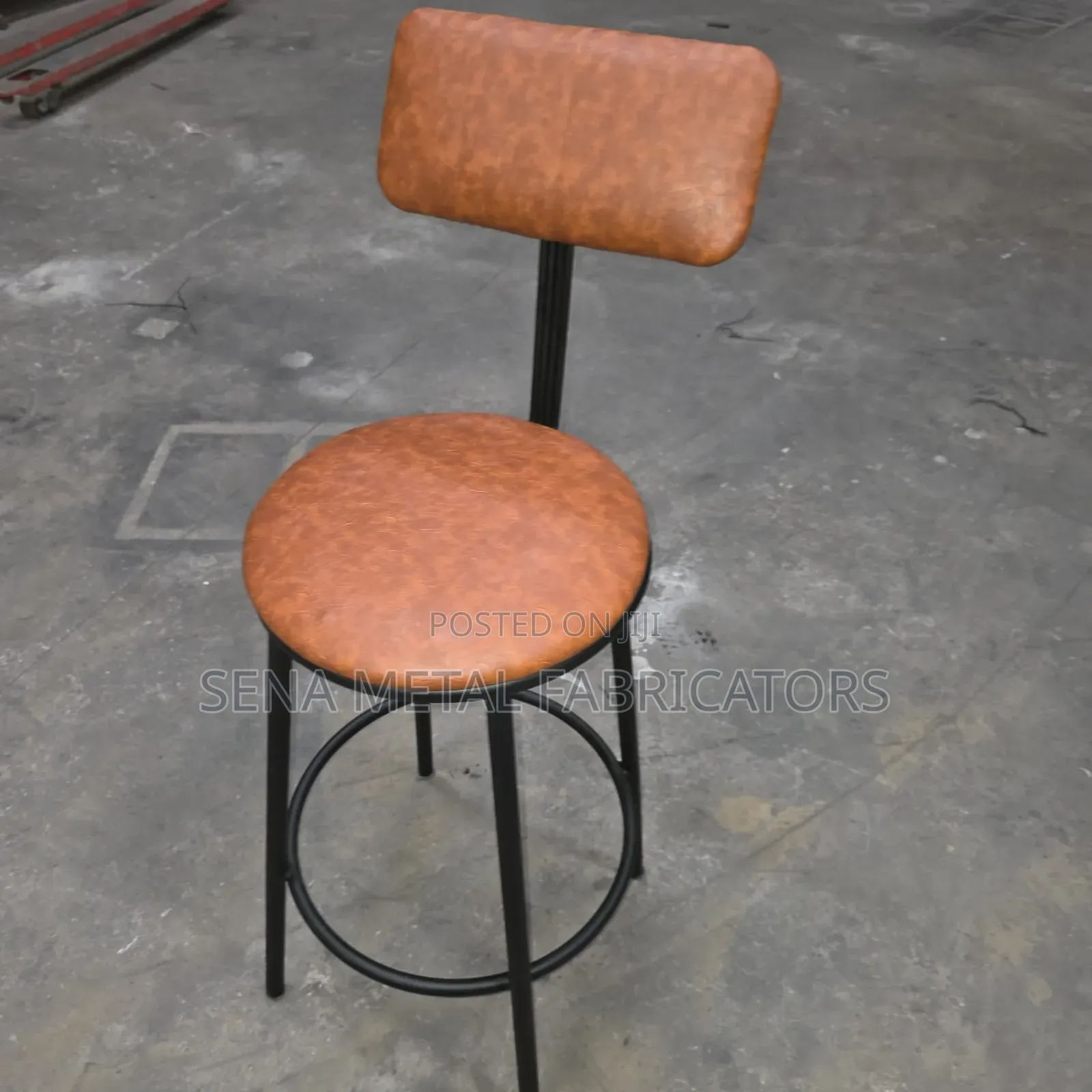 Modern Armless Backrest Counter Stool With Brown Cushion.