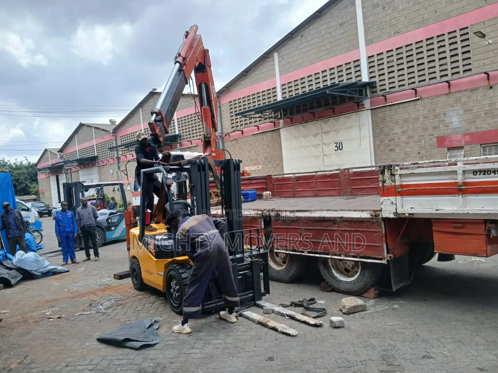 Flatbed Trailer With Crane Are Ready for Transportation