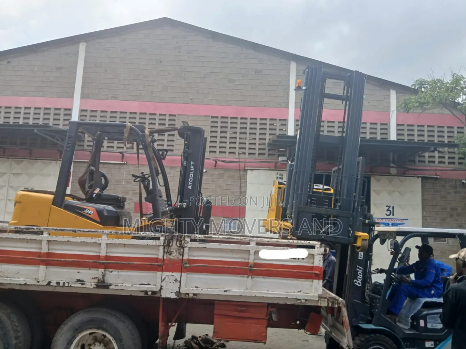 Flatbed Trailer With Crane Are Ready for Across Border Transportation
