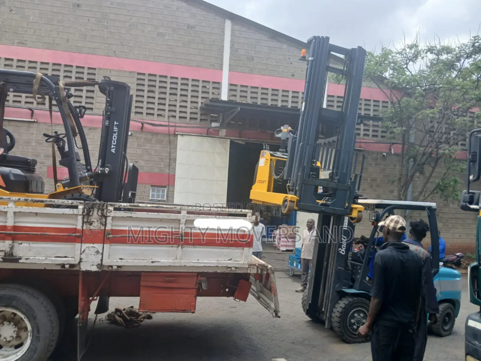 Flatbed Trailer With Crane Are Ready for Across Border Transportation