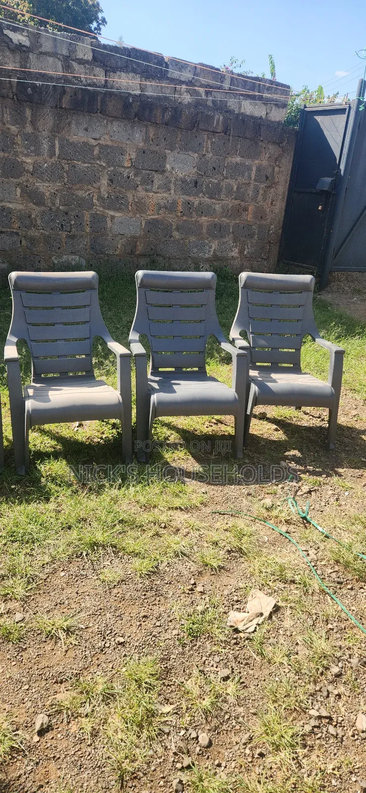 Gray Plastic Chairs With Slanting Backrest