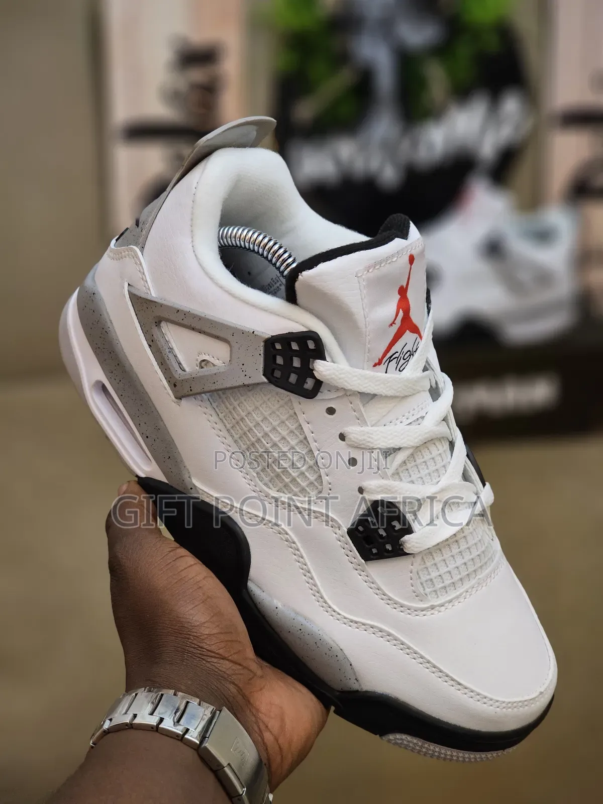 Nike Air Jordan 4 Retro "White Cement" Sneakers.