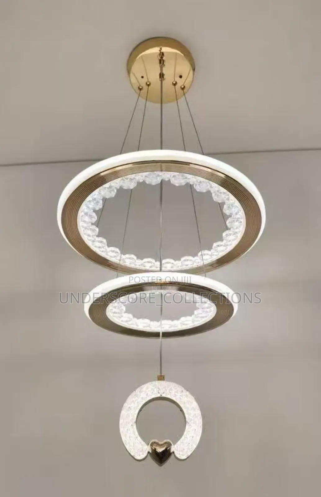 Modern Led Crystal Ring Chandelier With a Gold Finish.