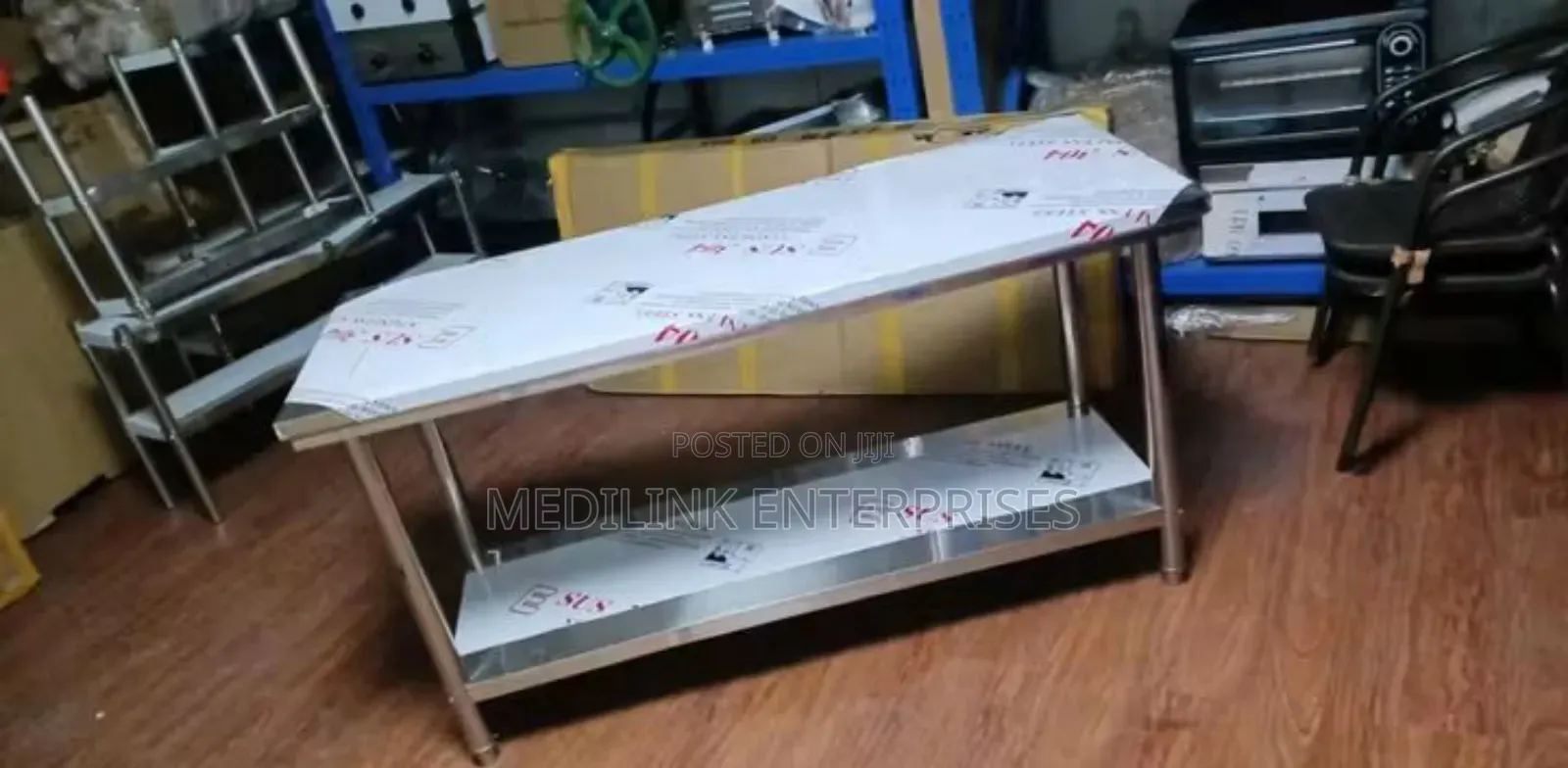 Stainless Steel Commercial Kitchen Working to Tables