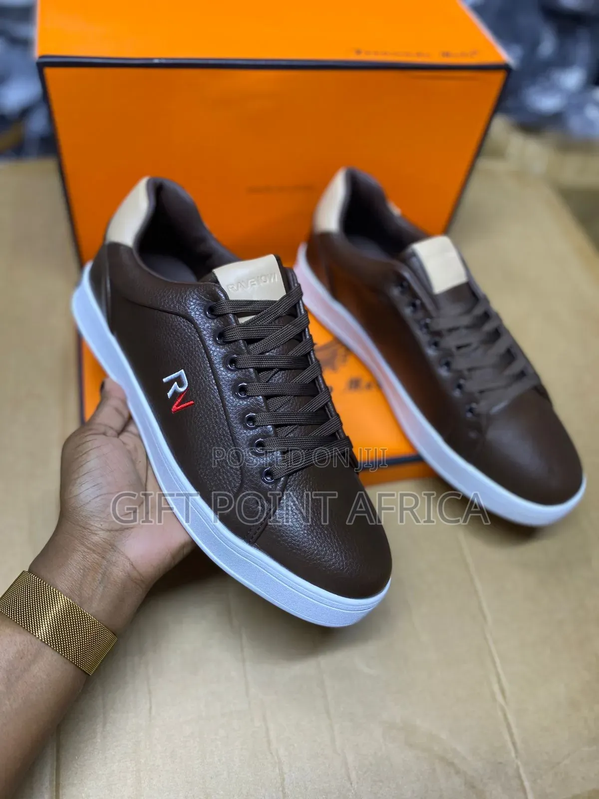 Brown Leather Sneaker With A White Sole And An "Rv" Logo.