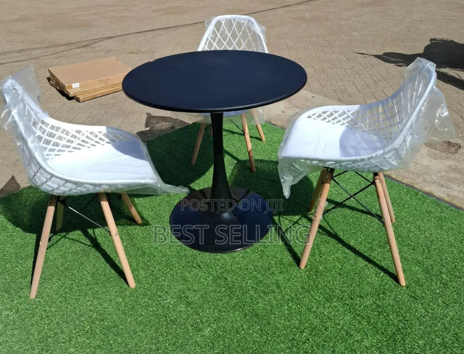 Black Dining Table and White Mesh Eams Chair