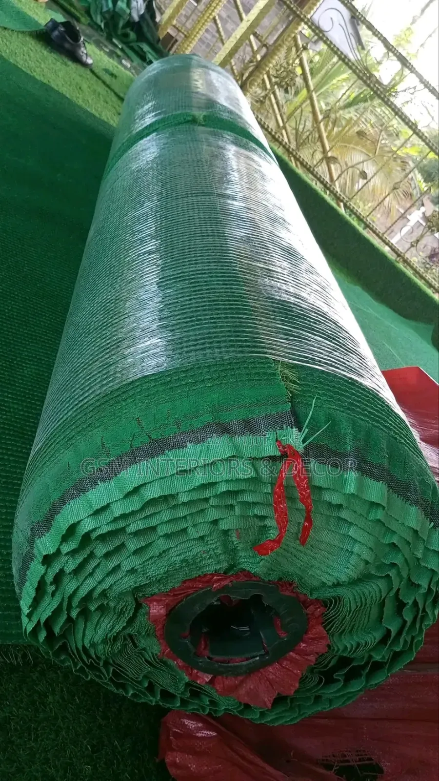 Artificial Green Grass Carpets Rolled Up