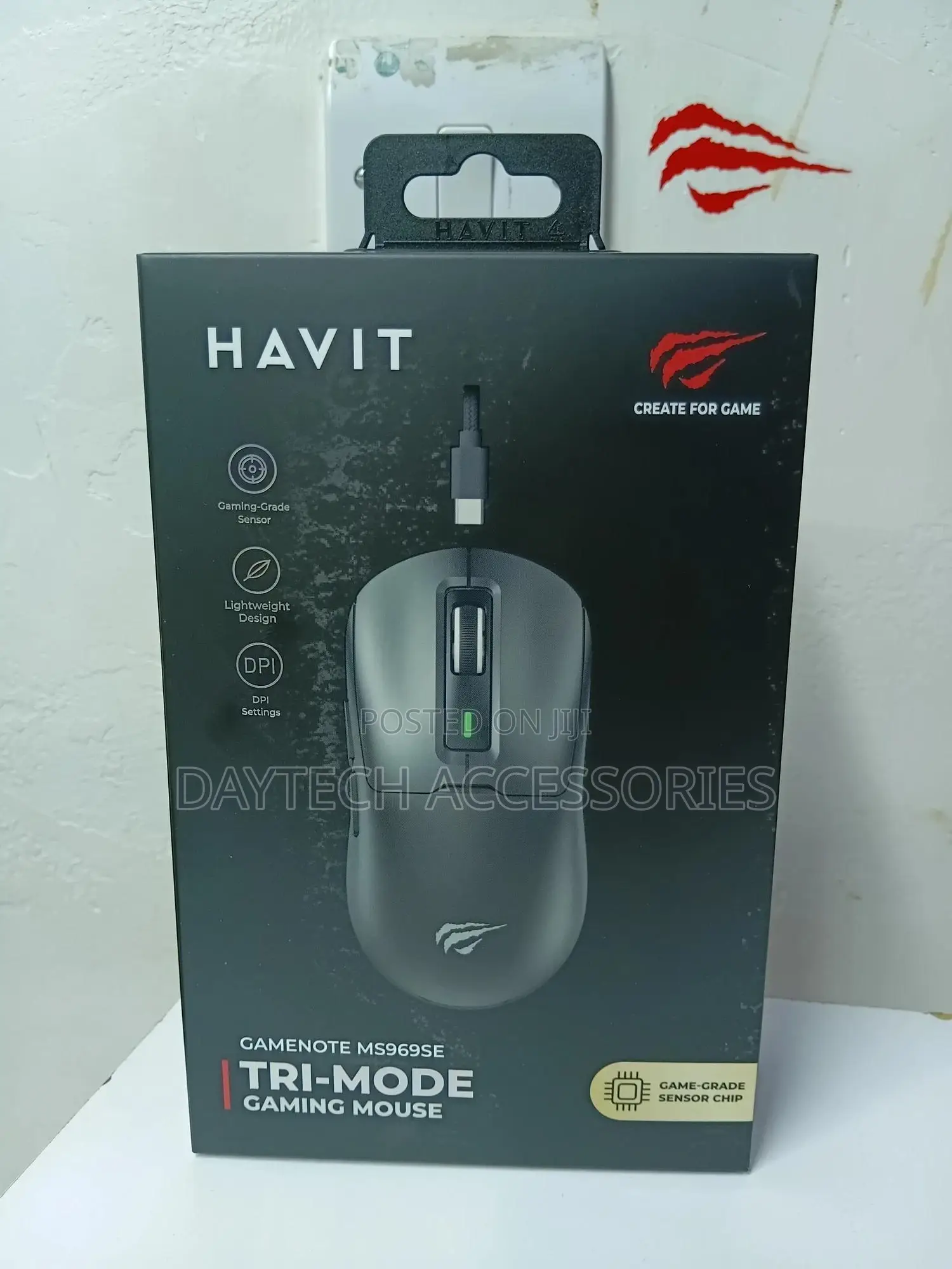 A Havit Gamenote Ms969se Tri-Mode Gaming Mouse.