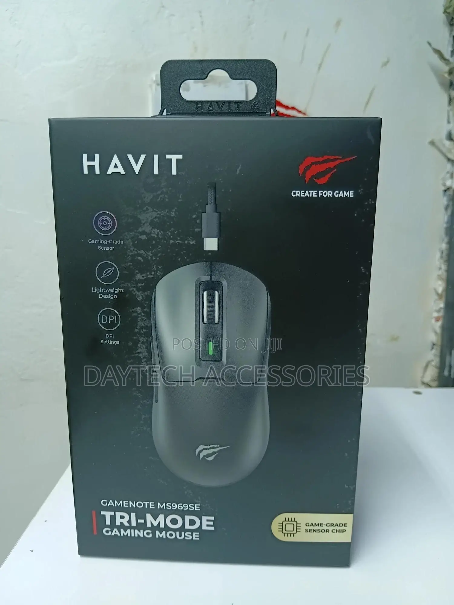 A Havit Gamenote Ms969se Tri-Mode Gaming Mouse.