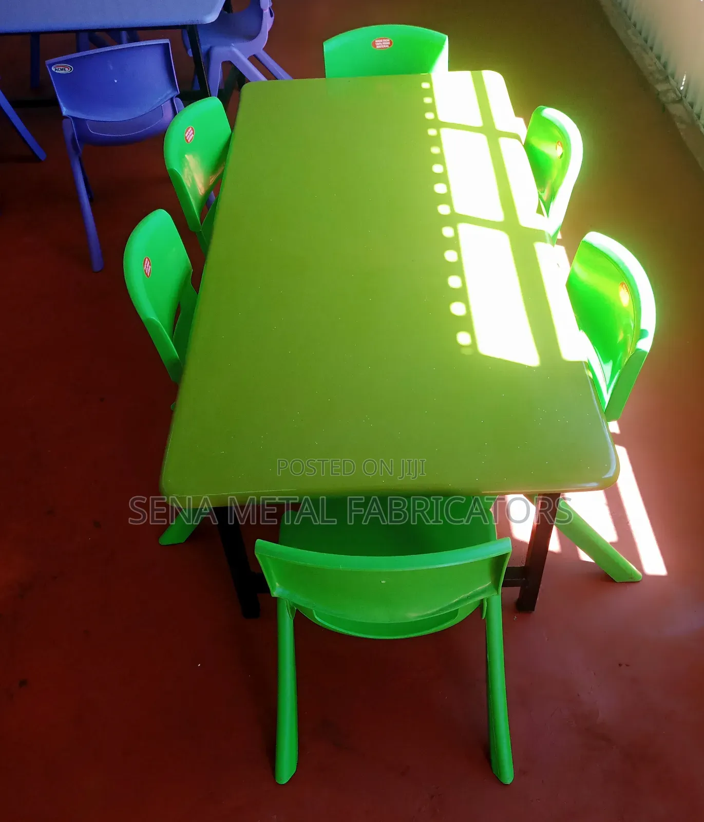 Plastic Kindergarten Chairs and a Table in Green .