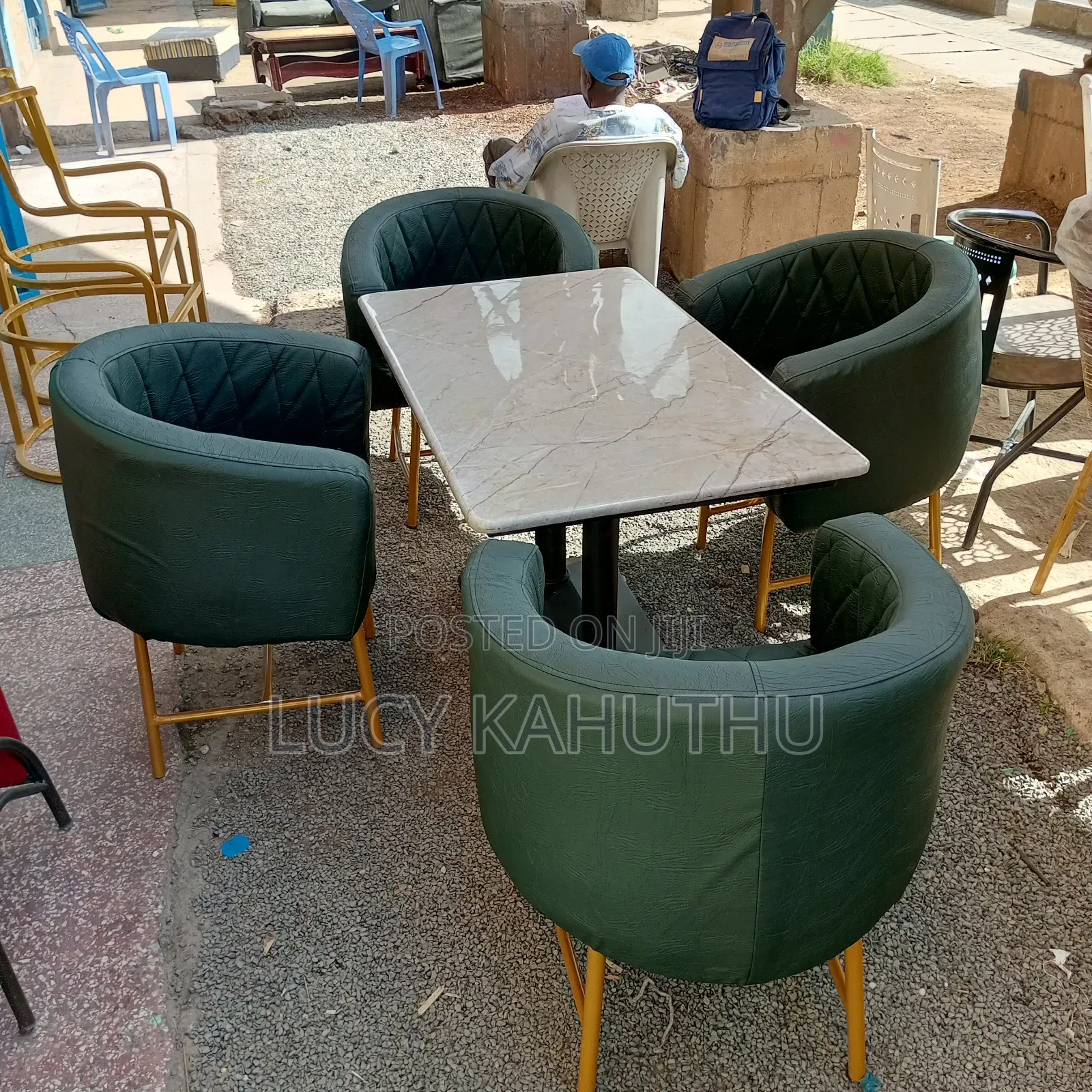 Double Leg Restaurant Table With Green Chairs