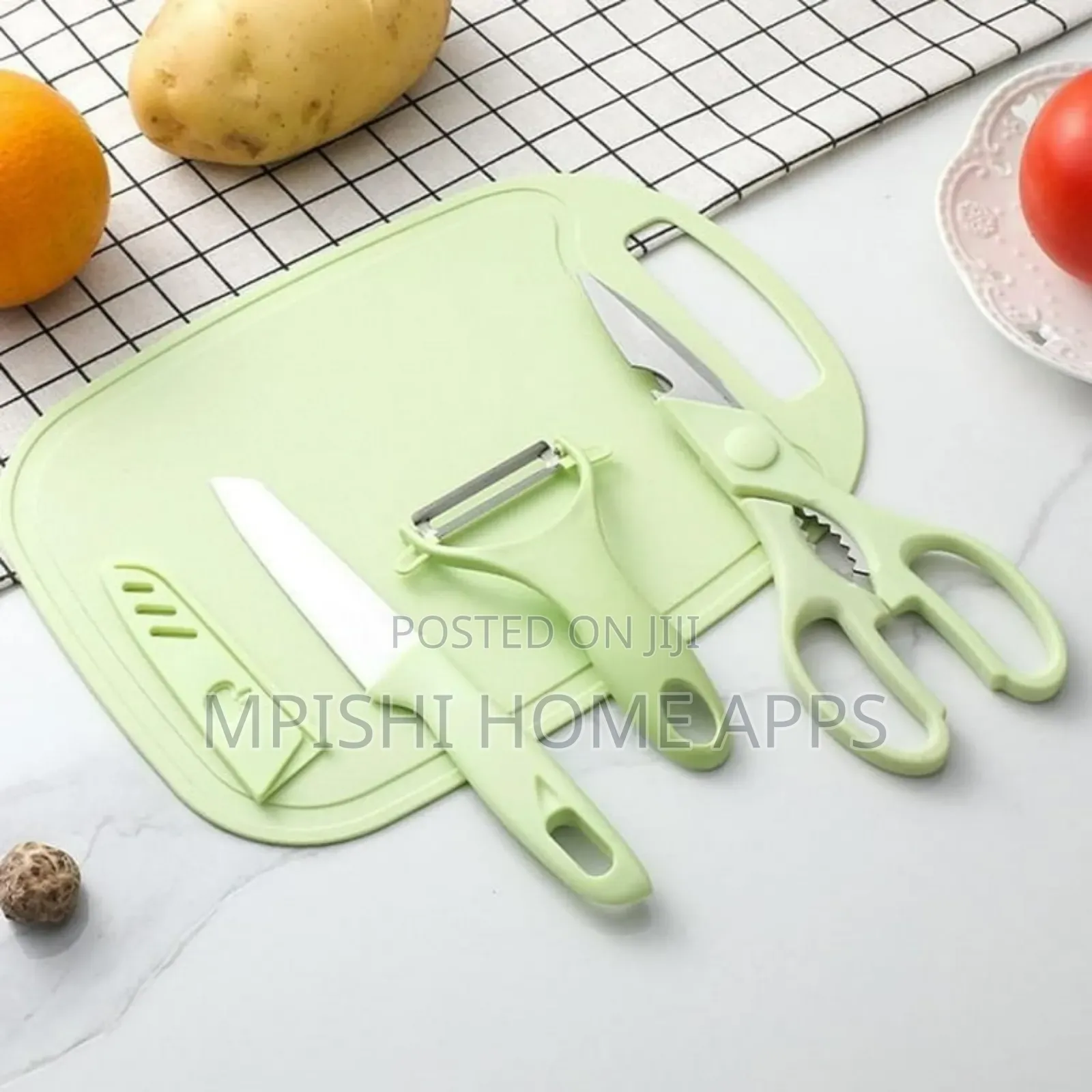 4-Piece Kitchen Set, a Knife, Peeler, Scissors, and a Cutting Board.