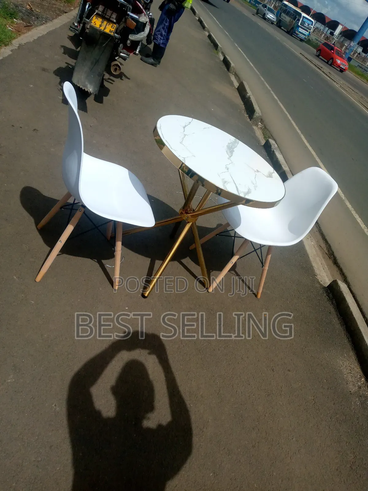 Golden Stand Marble Top Round Table and White Eames Chairs