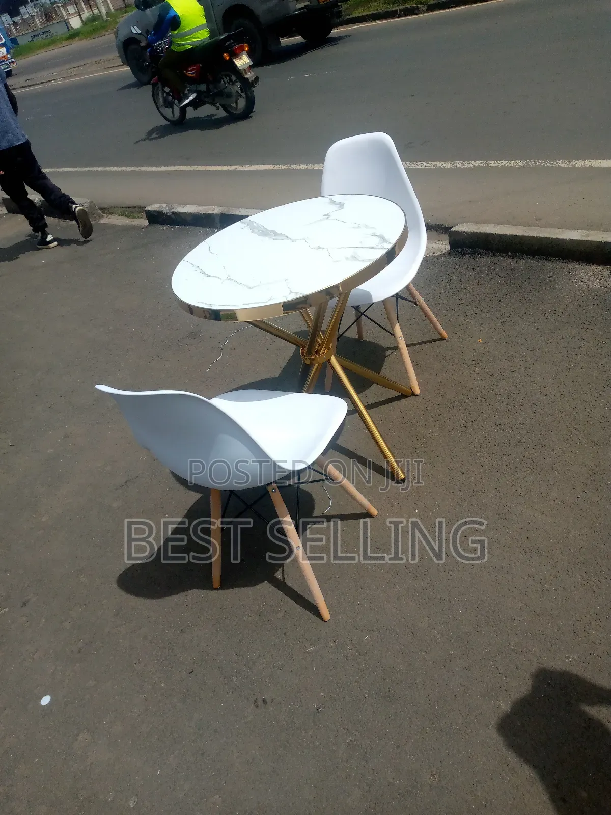 Golden Stand Marble Top Round Table and White Eames Chairs