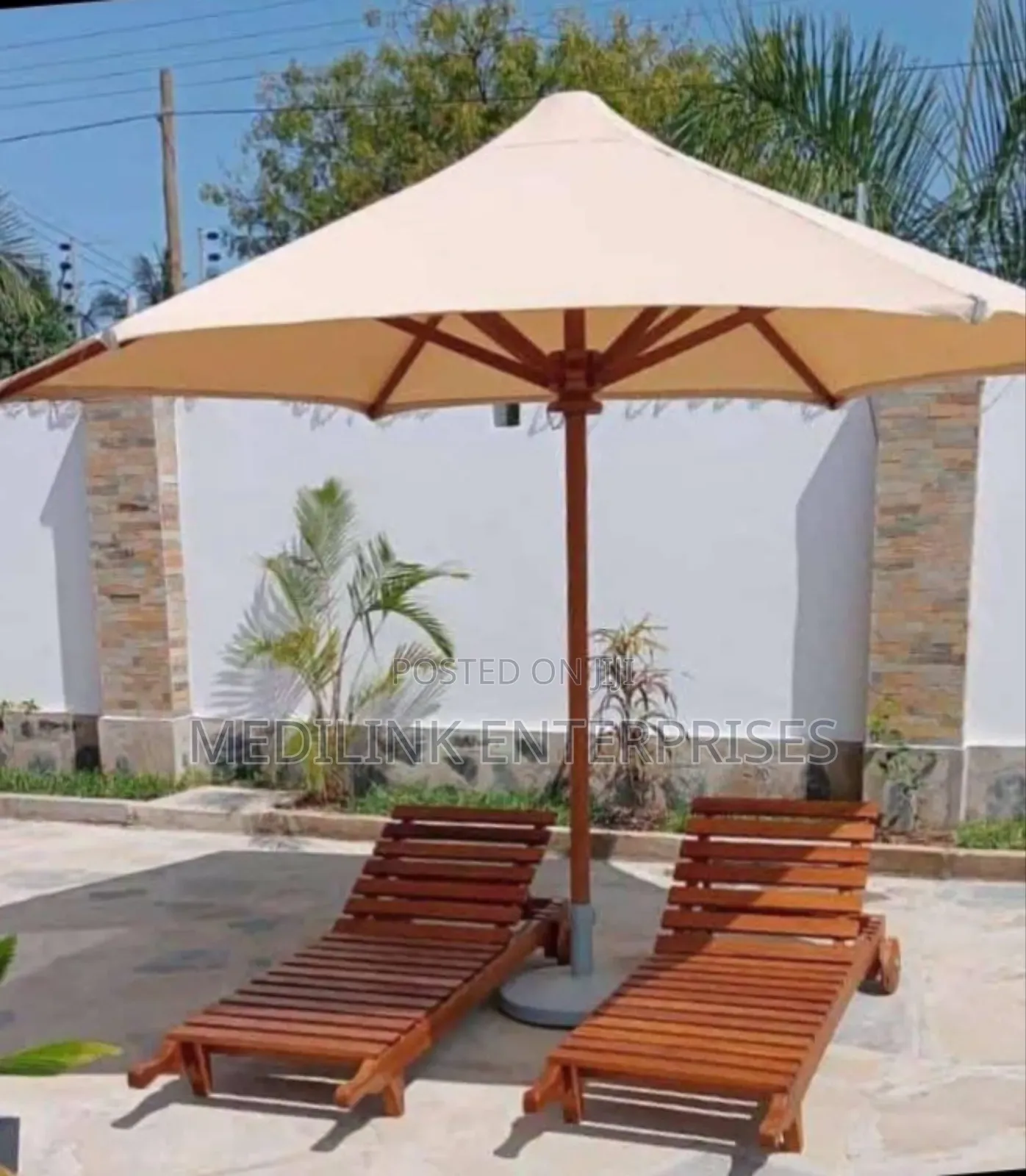 Wooden Foldable Sunbeds and a Parasol