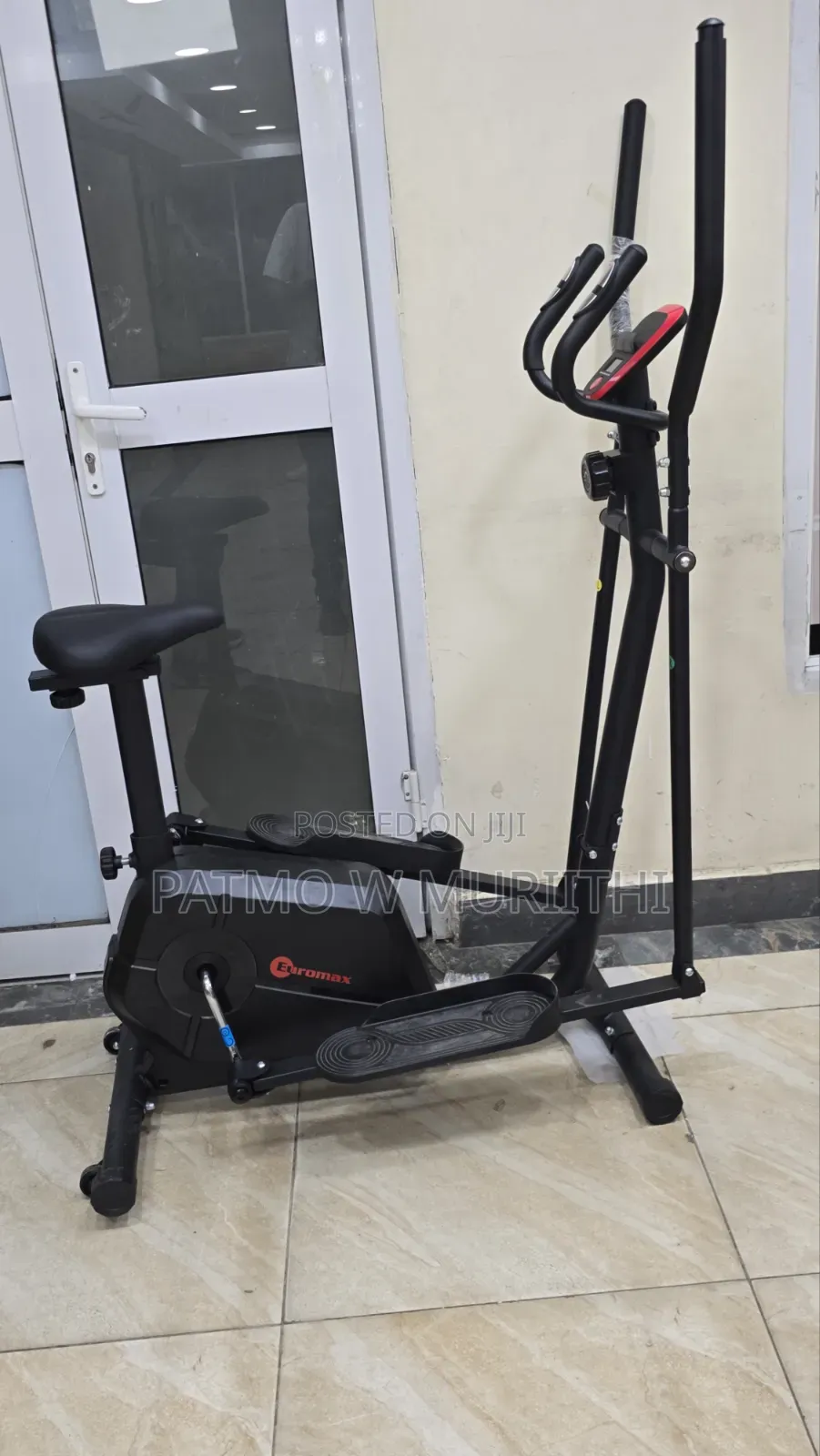 A Euromax Elliptical Cross Trainer Exercise Machine With a Seat.