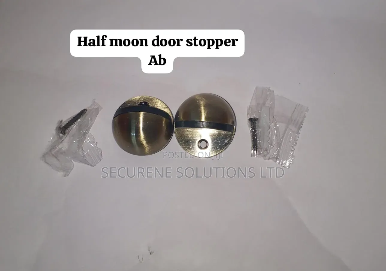 Bronze-Finished Ab Half-Moon Door Stoppers.