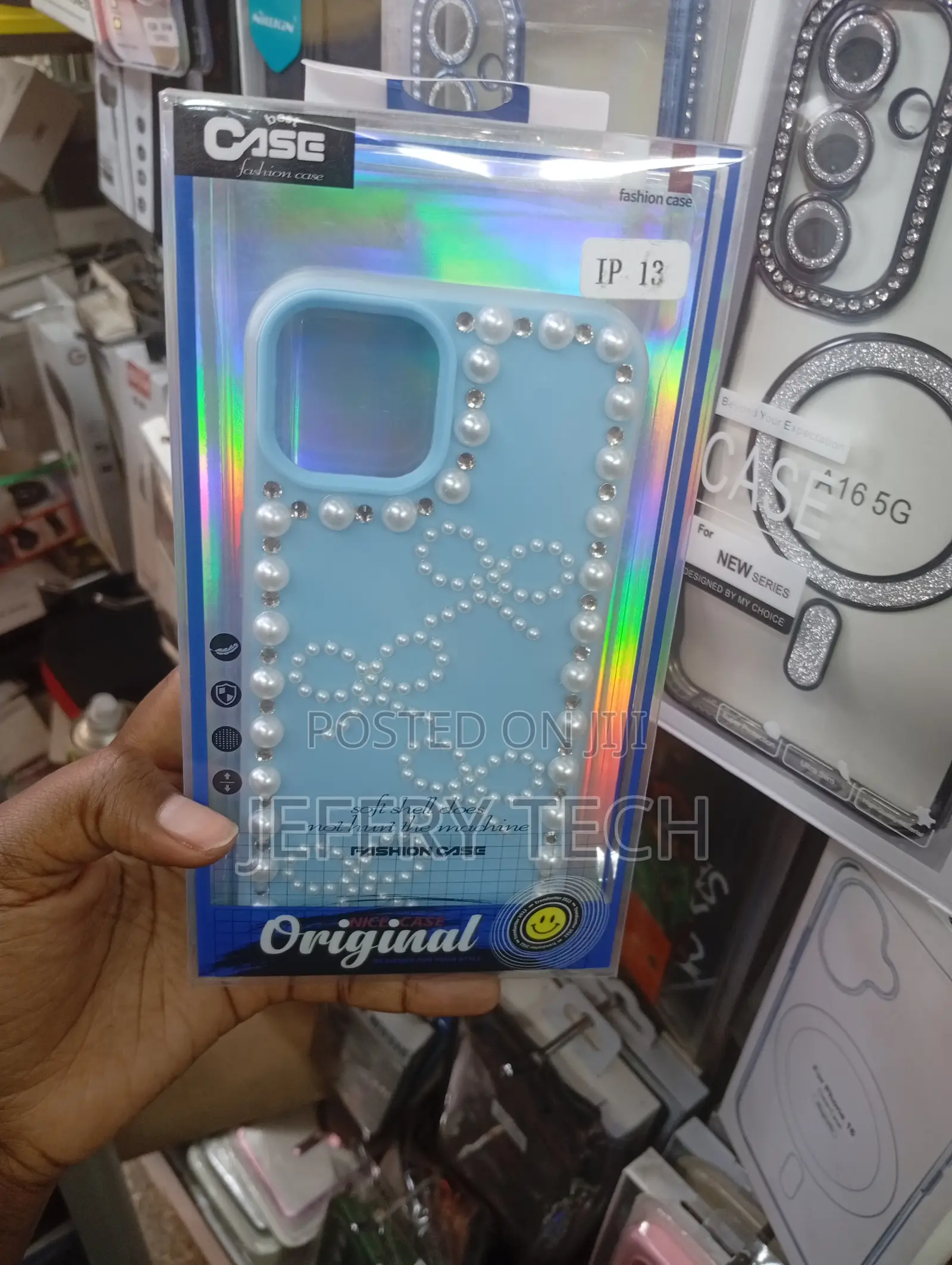 Blue Decorative Bow and Pearl Tpu Phone Case for an Apple iPhone 13.