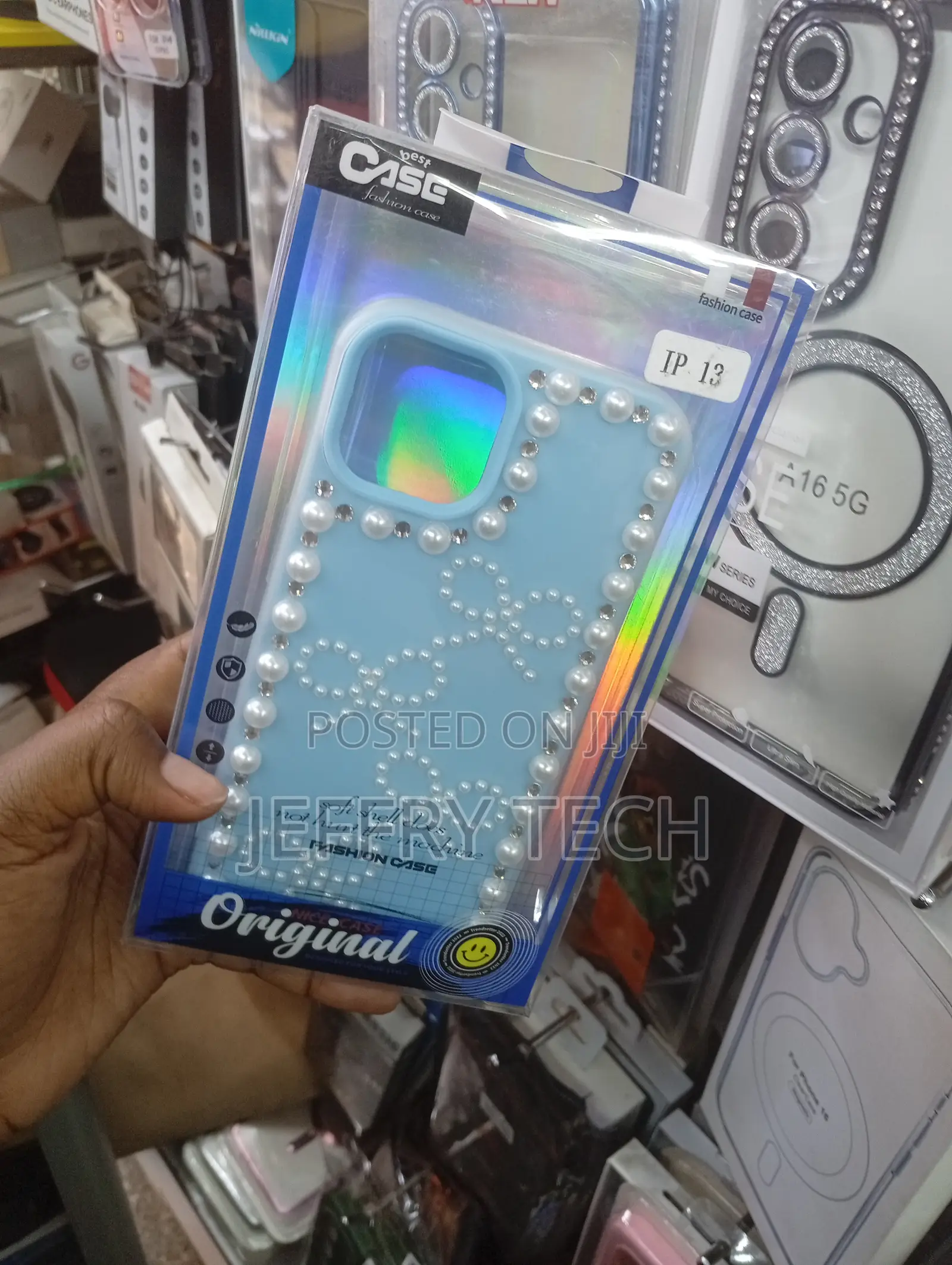 Blue Decorative Bow and Pearl Tpu Phone Case for an Apple iPhone 13.