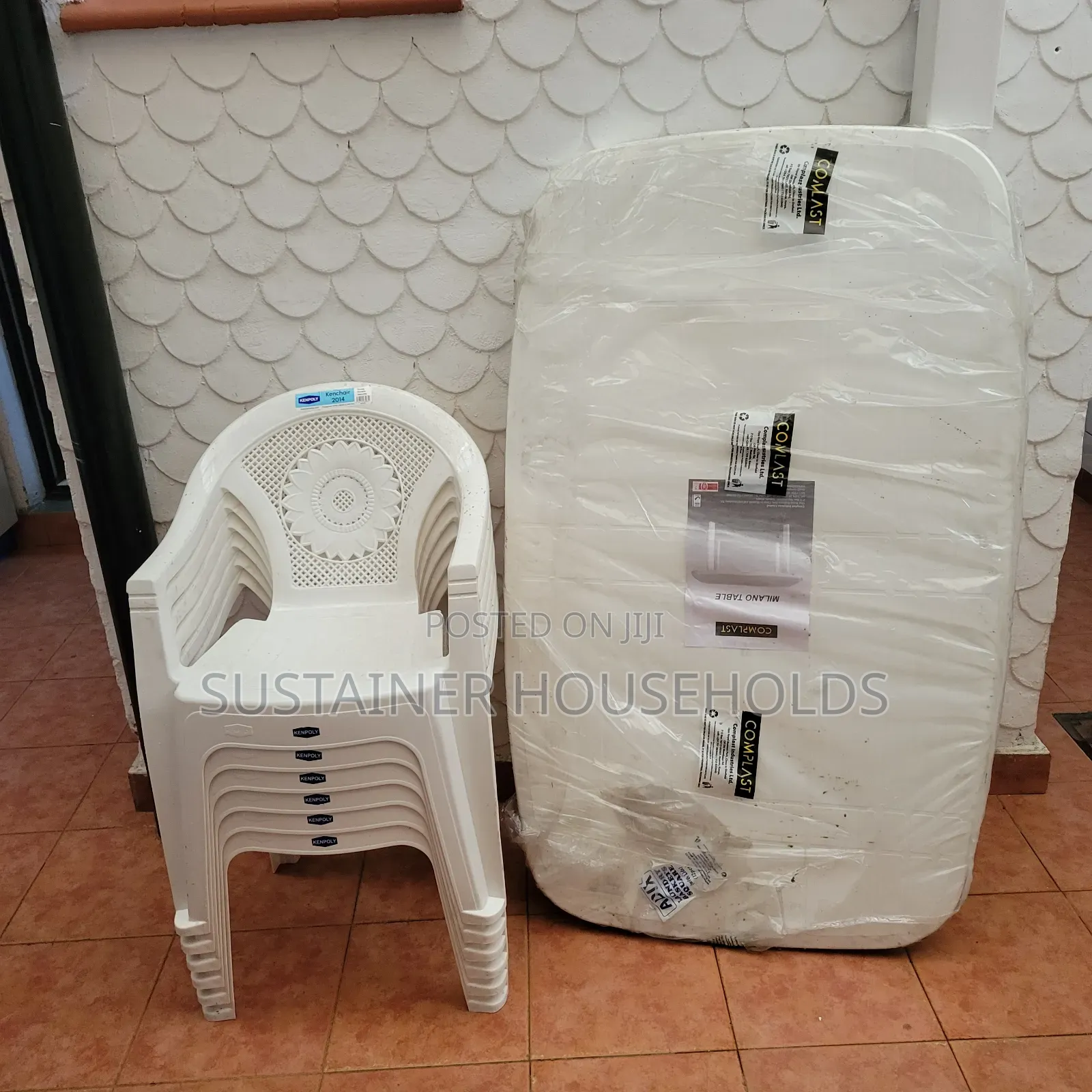 1 Table and 6 Kenpoly Arm Plastic Chairs